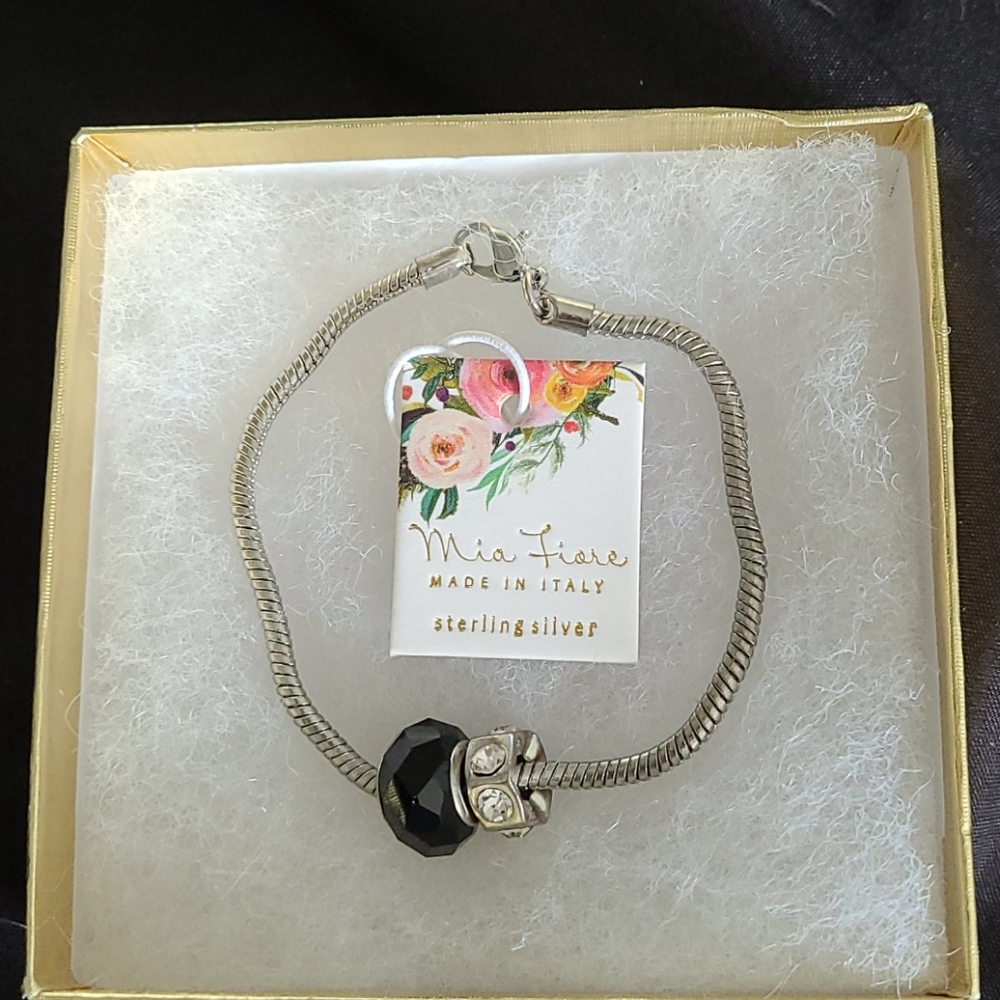 Ladies Sterling silver charm holding bracelet